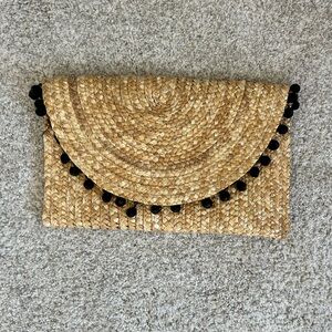 Woven Straw Clutch with Black Accents raffia Pom Pom